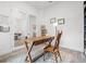 Bright, modern home office with wood desk, office chair, and natural light at 5436 Jessamine Ave, North Port, FL 34291