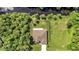 This eye-level view shows a well-maintained house with a spacious lawn and a fenced backyard at 5451 Prime Ter, North Port, FL 34286