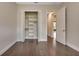 Bedroom features neutral walls, hardwood floors, and a closet with custom built-in storage solutions at 5451 Prime Ter, North Port, FL 34286