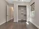 Bedroom closet featuring an open interior with shelves and rods for ample storage at 5451 Prime Ter, North Port, FL 34286