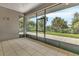 Screened lanai with views of the backyard and lush landscaping at 5451 Prime Ter, North Port, FL 34286