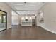 Bright open concept space offering access to a screened lanai and an adjacent kitchen at 5451 Prime Ter, North Port, FL 34286