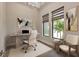 Bright office space featuring a modern desk, comfortable seating, and natural light from the windows at 5451 Prime Ter, North Port, FL 34286