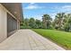 Covered patio with tile flooring and beautiful backyard views at 5451 Prime Ter, North Port, FL 34286