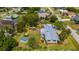 Aerial view of home featuring lush backyard and metal roof at 611 Bonita Ct, Punta Gorda, FL 33950