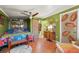 Bright bedroom with ceiling fan, ensuite bath, and unique, attractive design details at 611 Bonita Ct, Punta Gorda, FL 33950
