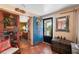 Inviting foyer with colorful blue doors and tiled flooring at 611 Bonita Ct, Punta Gorda, FL 33950
