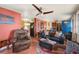 Spacious living room featuring a mix of textures, colorful accents, and ample seating at 611 Bonita Ct, Punta Gorda, FL 33950