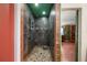 Walk-in shower features stone flooring, modern fixtures, and tiled walls at 611 Bonita Ct, Punta Gorda, FL 33950