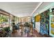 Bright sunroom with dining area, laundry, and plenty of space for plants at 611 Bonita Ct, Punta Gorda, FL 33950