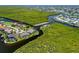 Expansive aerial view of waterfront homes with lush landscaping and private docks in a beautiful canal community at 632 Brindisi Ct, Punta Gorda, FL 33950