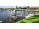 View of boat lift on waterfront property at 632 Brindisi Ct, Punta Gorda, FL 33950
