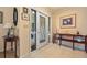 Bright foyer with tile flooring, console table, and decorative artwork at 632 Brindisi Ct, Punta Gorda, FL 33950