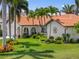 Beautiful one-story home with a tile roof, lush landscaping, and a well-maintained lawn at 632 Brindisi Ct, Punta Gorda, FL 33950
