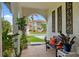 Inviting front porch with comfortable seating and stylish decorative details at 632 Brindisi Ct, Punta Gorda, FL 33950