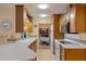 Kitchen view featuring white countertops, wooden cabinetry, and an open view to dining area at 632 Brindisi Ct, Punta Gorda, FL 33950