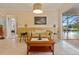 Living room features tile flooring and a view of the outdoor pool area through sliding glass doors at 632 Brindisi Ct, Punta Gorda, FL 33950