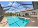 Screened pool with covered patio and lush landscaping at 632 Brindisi Ct, Punta Gorda, FL 33950