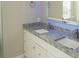 Bathroom vanity area featuring double sinks and ample counter space, great for modern living at 6794 Loffreda Ave, North Port, FL 34291
