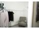 Walk in closet with built-in shelving for optimal storage, plus additional seating at 6794 Loffreda Ave, North Port, FL 34291