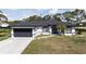 Charming single-story home featuring a spacious two-car garage and freshly manicured lawn at 6794 Loffreda Ave, North Port, FL 34291