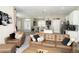 Open-concept living area flows into dining and kitchen with a cozy, inviting atmosphere at 6794 Loffreda Ave, North Port, FL 34291