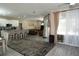 Open living space featuring an island kitchen with ample seating and views of the pool at 6794 Loffreda Ave, North Port, FL 34291
