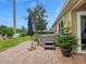 Relaxing backyard patio featuring a luxurious hot tub and umbrella, perfect for outdoor enjoyment at 7292 Mikasa Dr, Punta Gorda, FL 33950