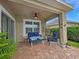 A serene covered patio with comfortable seating, perfect for relaxing outdoors at 7292 Mikasa Dr, Punta Gorda, FL 33950