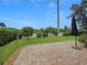 Beautifully landscaped backyard with a paved patio, offering a private outdoor retreat at 7292 Mikasa Dr, Punta Gorda, FL 33950