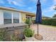 Spacious backyard featuring a patio, hot tub, and lush greenery, perfect for outdoor entertainment at 7292 Mikasa Dr, Punta Gorda, FL 33950