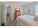 Bedroom with dresser, TV, view to hallway, and closet at 7292 Mikasa Dr, Punta Gorda, FL 33950
