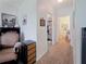 Cozy hallway with warm lighting, connecting to different areas of the house at 7292 Mikasa Dr, Punta Gorda, FL 33950