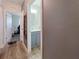 Hallway showcases doorways to other rooms and a dog; glimpses of an open floorplan are visible at 7292 Mikasa Dr, Punta Gorda, FL 33950