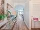 Bright and airy hallway with contemporary decor, leading to various rooms in the home at 7292 Mikasa Dr, Punta Gorda, FL 33950
