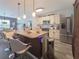 Stylish kitchen with an expansive island, stainless steel appliances, and plenty of cabinet space at 7292 Mikasa Dr, Punta Gorda, FL 33950