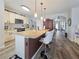 Spacious kitchen featuring a large island with bar seating, modern appliances, and ample counter space at 7292 Mikasa Dr, Punta Gorda, FL 33950