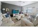 Comfortable living room featuring modern decor, stylish furniture, and abundant natural light at 7292 Mikasa Dr, Punta Gorda, FL 33950