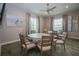 Inviting meeting room provides round table for residents to sit and enjoy each others company at 7292 Mikasa Dr, Punta Gorda, FL 33950