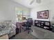 Bright office space features a comfortable chair, large window, desk, and shelving for a productive work environment at 7292 Mikasa Dr, Punta Gorda, FL 33950