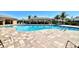 Inviting community pool area with lounge chairs and a covered cabana for relaxation and social gatherings at 7292 Mikasa Dr, Punta Gorda, FL 33950
