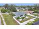 An inviting home with a pool, surrounded by mature trees, enhances outdoor living at 1007 Comstock St, Port Charlotte, FL 33952