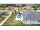 An aerial view of a lovely home features a pool and manicured landscaping for outdoor enjoyment at 1007 Comstock St, Port Charlotte, FL 33952