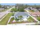 Charming home boasts a private pool, surrounded by lush greenery and a fenced yard at 1007 Comstock St, Port Charlotte, FL 33952