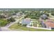 This overhead angle captures lush landscaping surrounding a home with a refreshing pool at 1007 Comstock St, Port Charlotte, FL 33952