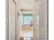 Bathroom with a bathtub and a window that allows natural light to flood the room at 1007 Comstock St, Port Charlotte, FL 33952