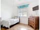 Cozy bedroom with hardwood floors, natural light and a minimalist decor at 1007 Comstock St, Port Charlotte, FL 33952