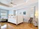 Spacious bedroom with hardwood floors, bright lighting and a minimalist decor at 1007 Comstock St, Port Charlotte, FL 33952