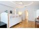 Spacious bedroom with hardwood floors, bright lighting and a minimalist decor at 1007 Comstock St, Port Charlotte, FL 33952