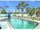 Backyard pool with beautiful landscaping and a spacious patio area at 1007 Comstock St, Port Charlotte, FL 33952